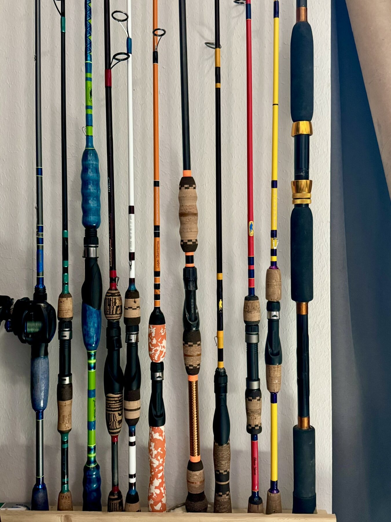 A collection of colorful handcrafted Forever Rods fishing rods